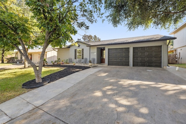 ranch-style house with a front lawn and a garage