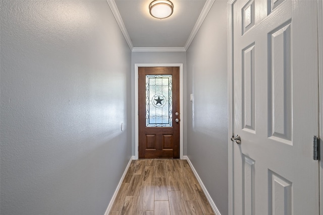 doorway featuring ornamental molding and wood-type flooring