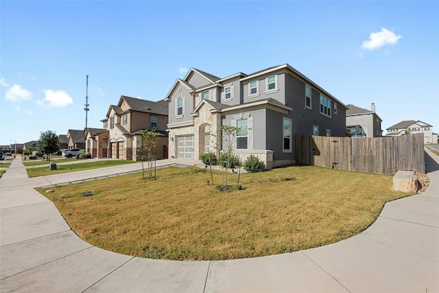 view of front of house featuring a front yard and a garage