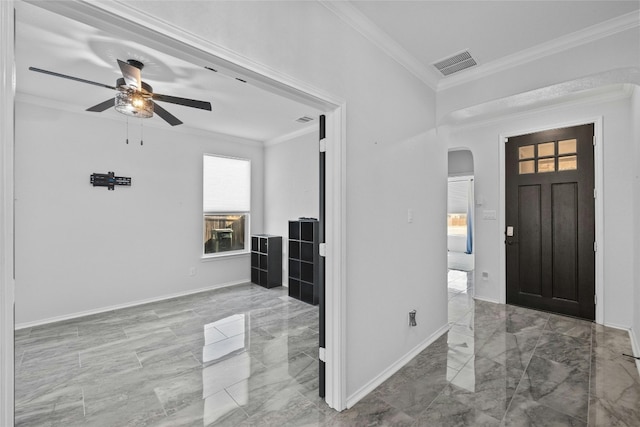 entrance foyer with ornamental molding and ceiling fan