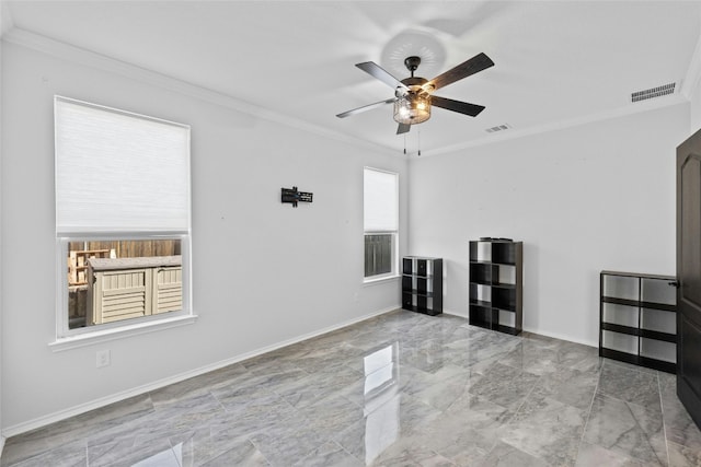 empty room with crown molding and ceiling fan