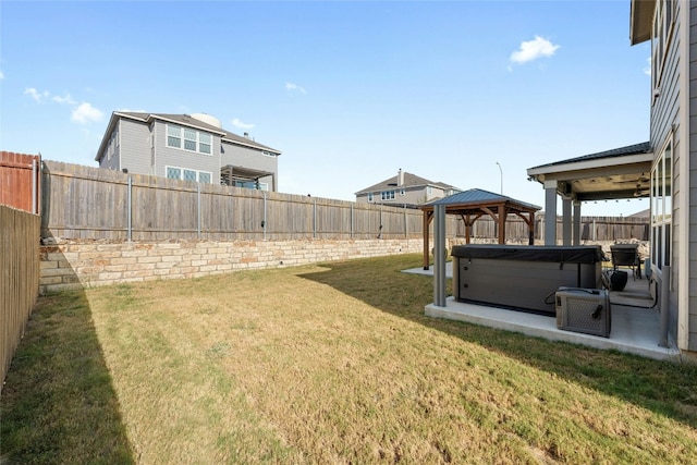 view of yard with a gazebo and a hot tub