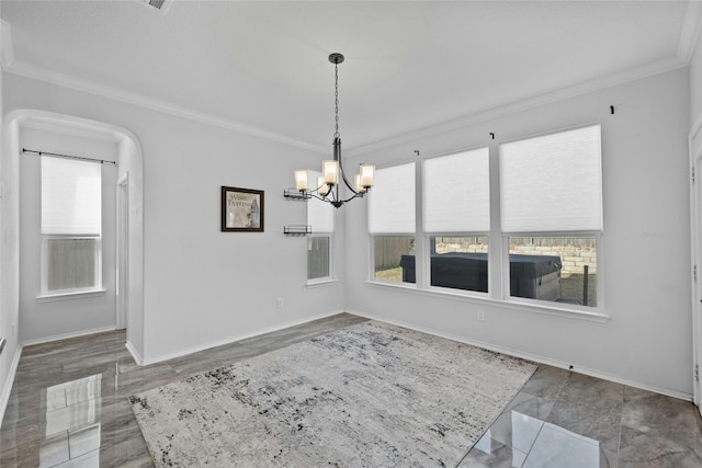 unfurnished room featuring crown molding, a chandelier, and plenty of natural light