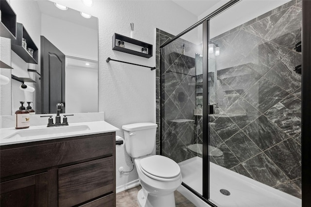 bathroom featuring vanity, toilet, and walk in shower