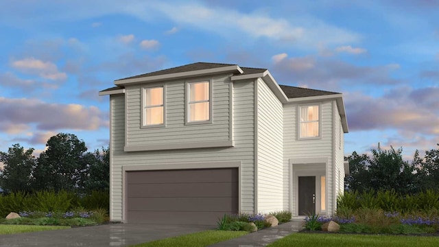 view of front facade with a garage and driveway