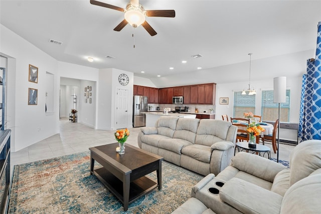 tiled living room with ceiling fan with notable chandelier