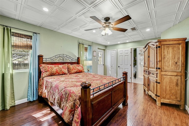 bedroom featuring wood-type flooring and ceiling fan