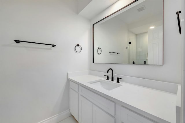 bathroom featuring vanity and an enclosed shower