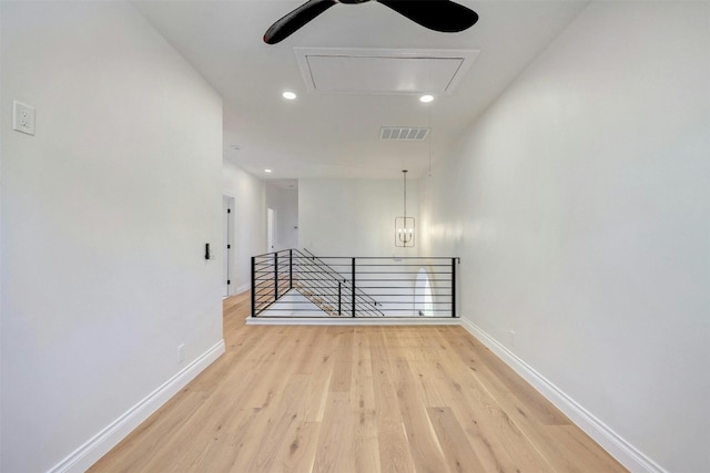 hall with light hardwood / wood-style floors