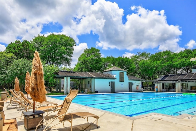 view of swimming pool with a patio area