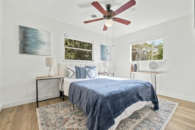 bedroom featuring ceiling fan and light hardwood / wood-style floors