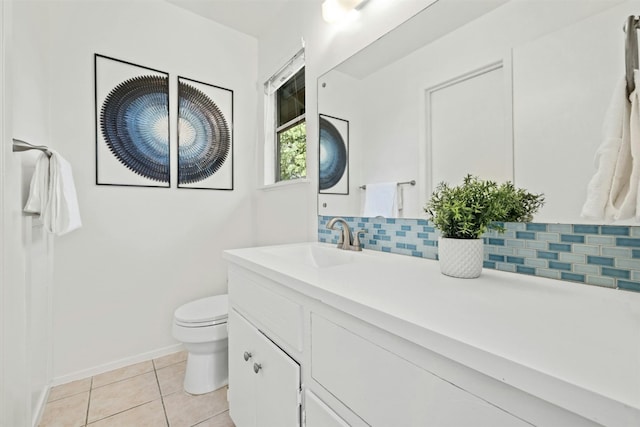 bathroom featuring vanity, decorative backsplash, toilet, and tile patterned flooring