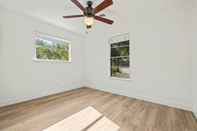 empty room with light hardwood / wood-style flooring and ceiling fan