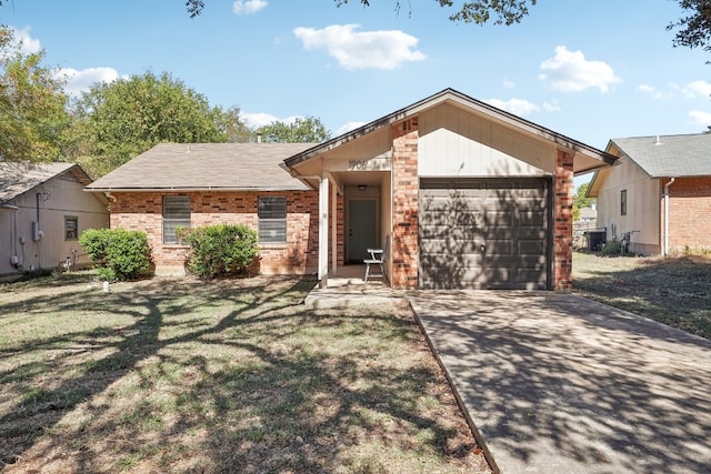 single story home featuring a garage and a front lawn