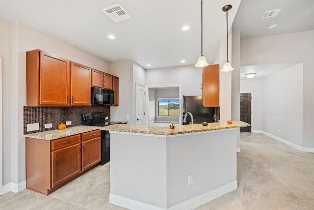 124 Park Place Dr, Georgetown, TX 78628 - kitchen with black appliances, brown cabinetry, light stone counters, tasteful backsplash, and recessed lighting