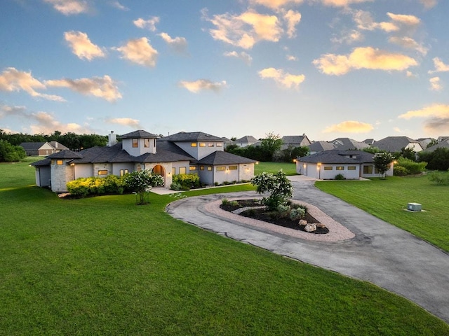 124 Park Place Dr, Georgetown, TX 78628 - view of front of property featuring curved driveway, a front lawn, and a residential view