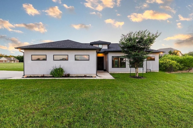 124 Park Place Dr, Georgetown, TX 78628 - prairie-style house with a front yard and stucco siding