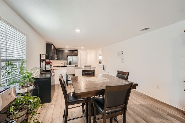 dining room with light hardwood / wood-style floors