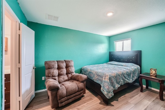 bedroom featuring light wood-type flooring