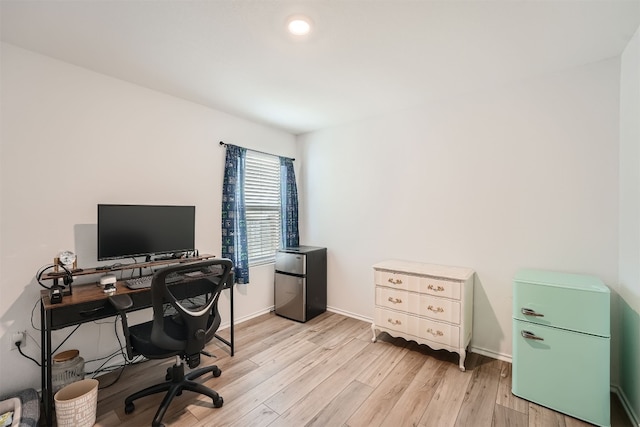 office with light hardwood / wood-style floors