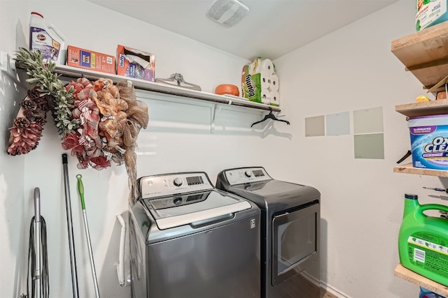 washroom featuring independent washer and dryer