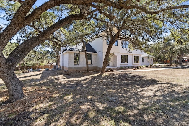 view of front of home featuring cooling unit