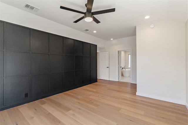 spare room featuring ceiling fan and light hardwood / wood-style flooring