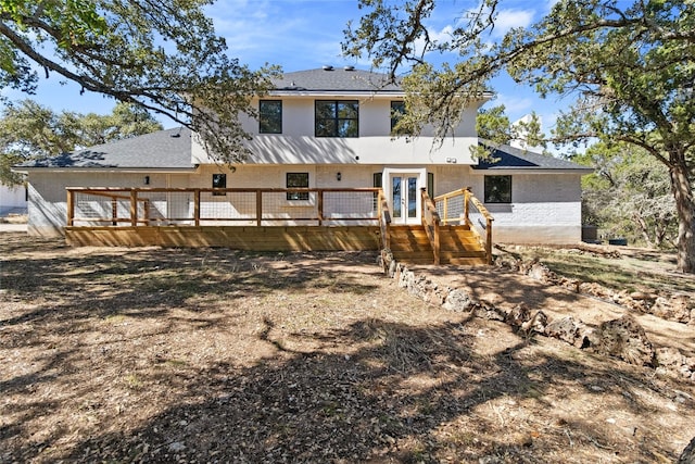 back of property featuring french doors and a deck