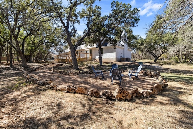 view of yard with a fire pit