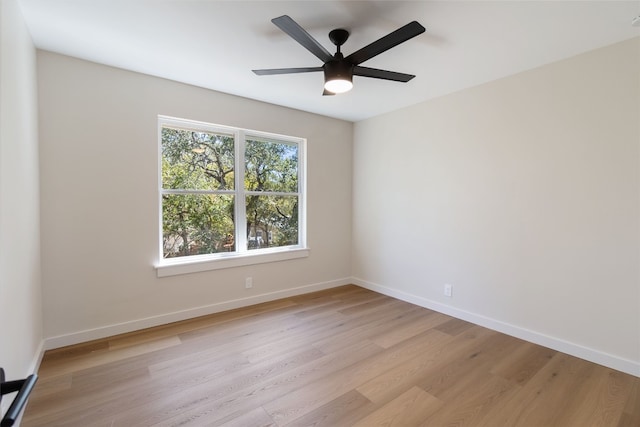 empty room with light hardwood / wood-style floors and ceiling fan