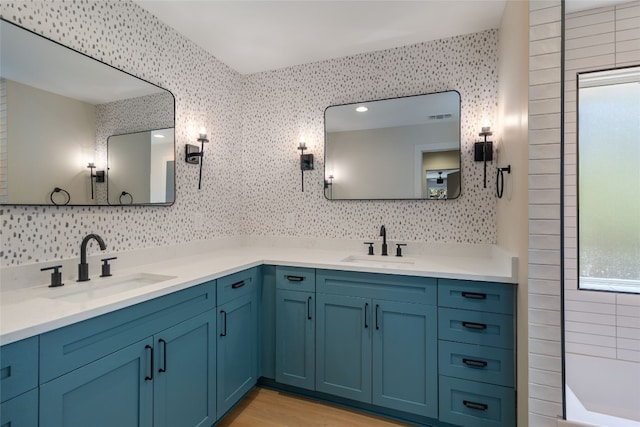 bathroom with vanity, wood-type flooring, and backsplash