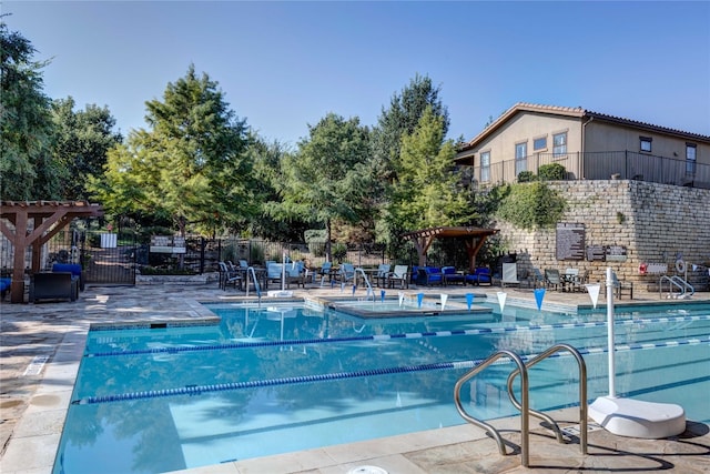 view of pool featuring a patio and a jacuzzi