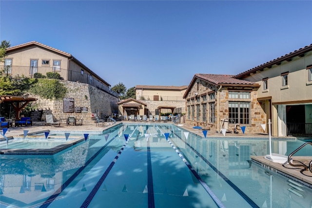 view of swimming pool featuring a patio