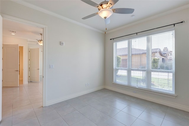 spare room with crown molding, light tile patterned flooring, and ceiling fan