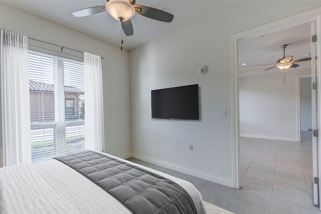 tiled bedroom with ceiling fan