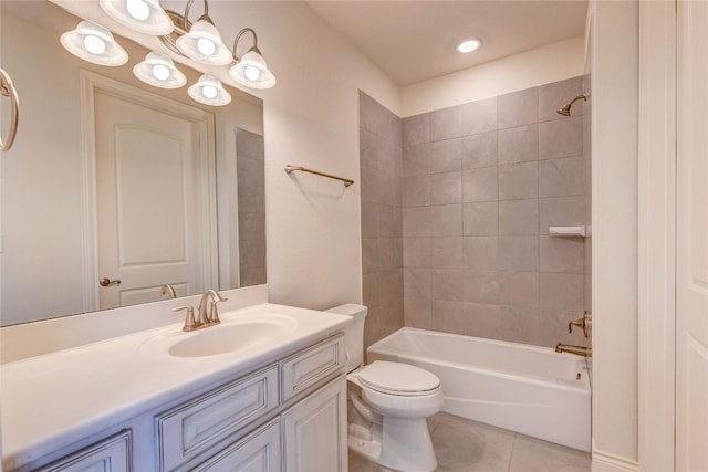 full bathroom with toilet, tiled shower / bath combo, vanity, and tile patterned flooring