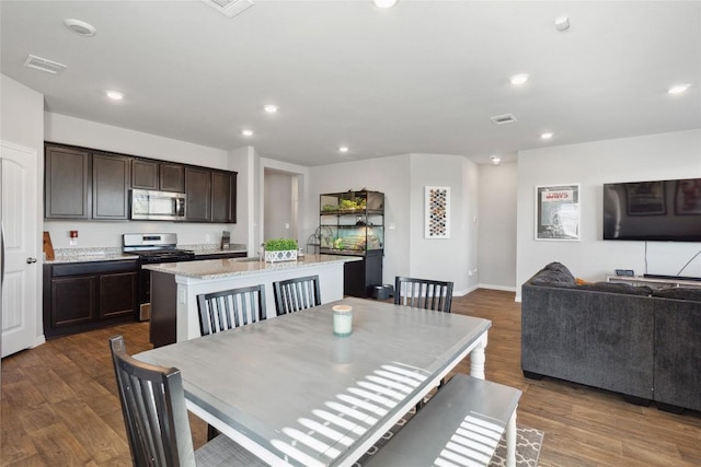 dining room with dark hardwood / wood-style floors