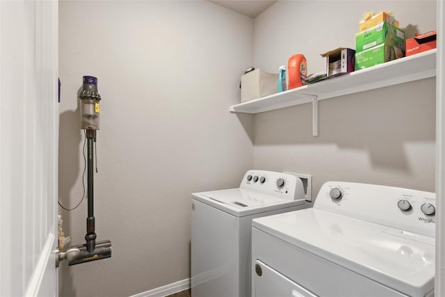 clothes washing area featuring washing machine and clothes dryer