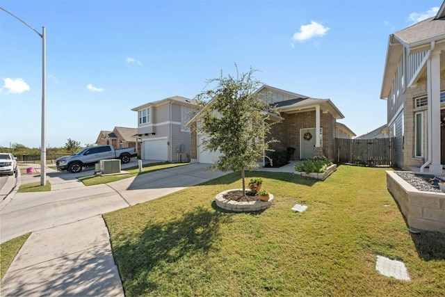 view of front facade featuring a garage and a front lawn