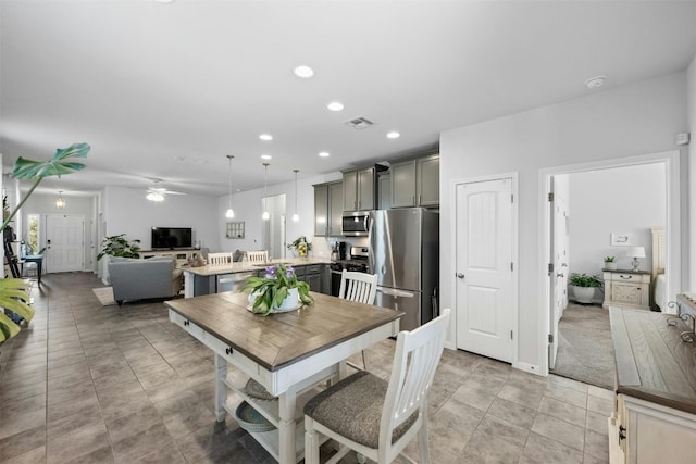 dining space featuring ceiling fan