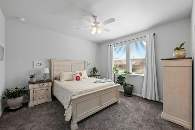 bedroom featuring dark colored carpet and ceiling fan