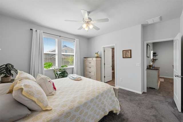 bedroom featuring carpet, ceiling fan, and ensuite bath