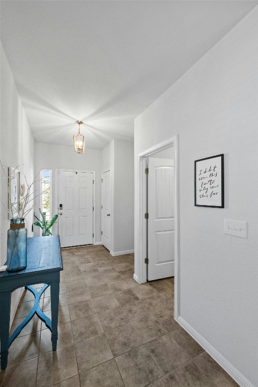 foyer with a notable chandelier