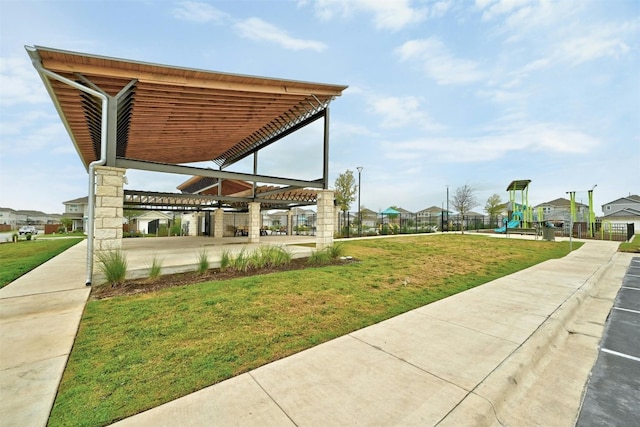 view of property's community featuring a yard