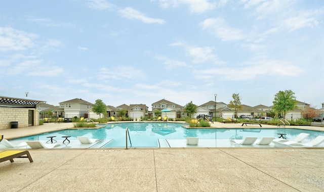 view of swimming pool with a patio