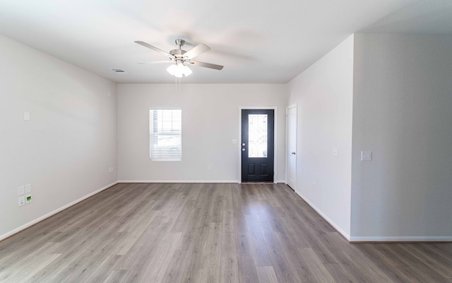 entrance foyer with ceiling fan and light hardwood / wood-style flooring