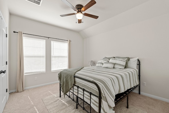 carpeted bedroom featuring ceiling fan and vaulted ceiling