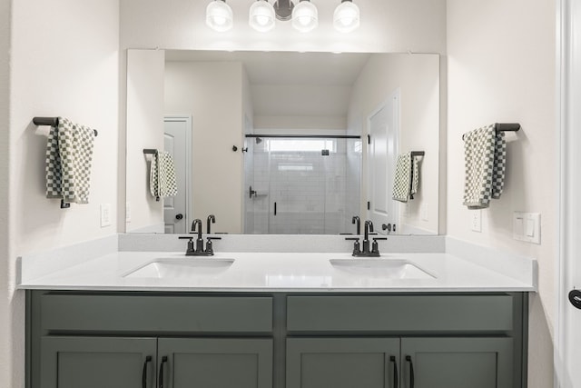 bathroom with vanity and a shower with shower door