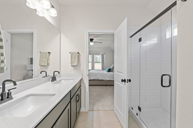 bathroom featuring tile patterned flooring, vanity, ceiling fan, and an enclosed shower