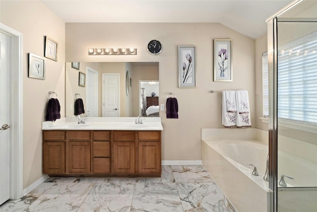 bathroom featuring vanity, separate shower and tub, and lofted ceiling